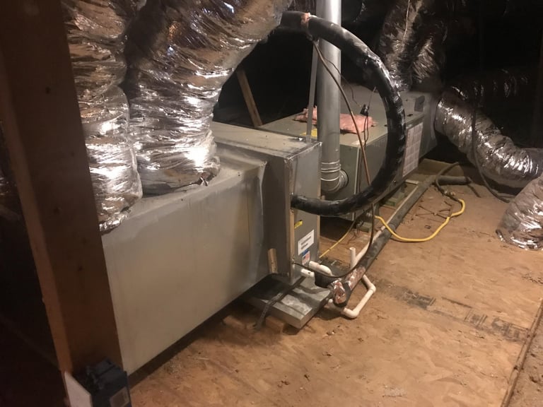 Air duct cleaning in an attic space with insulation and ductwork